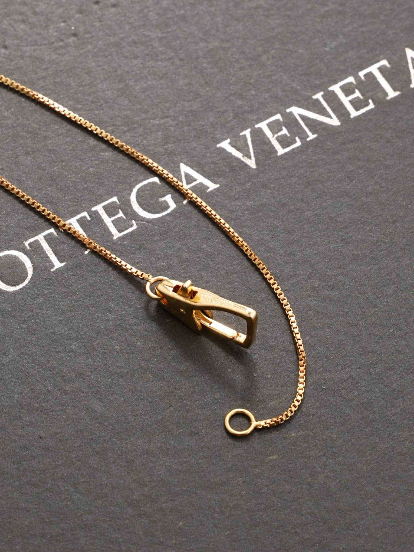 Bottega Veneta Elegant Gold and Silver Pendant Necklace